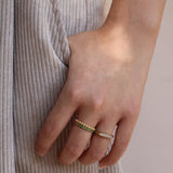 Elongated oval pave set diamond signet band